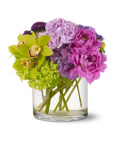 <p>This Ethereal Beauty Bouquet captures all the delicate tones of a watercolor painting. Green orchids and purple dahlias mingle with lavender and chartreuse blooms to create a vision of pure beauty arranged in a cylindrical clear glass vase.</p>
