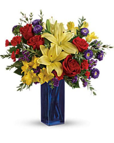 <div id="mark-3" class="m-pdp-tabs-marketing-description">Make their spirits fly with this bold bouquet! The colorful mix of red roses, yellow lilies and purple asters looks right at home in a cool, cobalt glass vase.</div>
<div id="desc-3">
<ul>
<li>This colorful arrangement includes red roses, yellow asiatic lilies, yellow alstroemeria, red miniature carnations, purple matsumoto asters, purple sinuata statice, parvifolia eucalyptus, and lemon leaf.</li>
</ul>
</div>