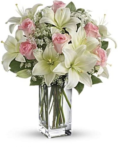 <div id="mark-3" class="m-pdp-tabs-marketing-description">Stunning in its simplicity, this innocent harmony of light pink roses and snow white lilies are a heartfelt way to send your very best. The classic, clear rectangular glass vase keeps the focus on the heavenly beauty of the blooms.</div>
<p>&nbsp;</p>
<div id="desc-3">
<ul>
<li>Light pink roses and white asiatic lilies form a fragrant bouquet with delicate touches of Queen Anne's lace and rich green salal.</li>
</ul>
</div>