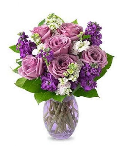 <p>Lovely lavender roses, lavender stock, and pink stock are accented with a variety of lush greens in this amazing floral arrangement. Presented in a glass vase, the bouquet is a wonderful gift to help celebrate an anniversary, a birthday, or just because.</p>