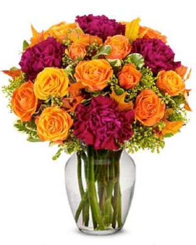 <p>Enjoy this dazzling array of purple and orange guaranteed to brighten anyone's day. A gorgeous assortment of beautiful flowers carefully procured by our artisan designers, we hope that the smiles that we deliver daily helps you make everlasting memories.</p>
