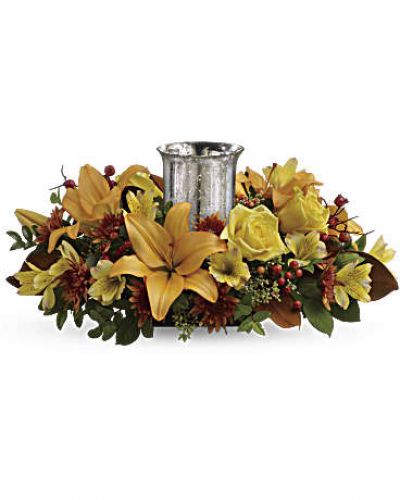 <div id="mark-3" class="m-pdp-tabs-marketing-description">A fabulous centerpiece for any fall occasion, this arrangment's glass hurricane shimmers and shines within a lush arrangement of roses and lilies.</div>
<p>&nbsp;</p>
<div id="desc-3">
<ul>
<li>This beautiful arrangement features yellow roses, peach asiatic lilies, yellow alstroemeria, bronze cushion chrysanthemums, seeded eucalyptus, huckleberry and orange berries.</li>
</ul>
</div>