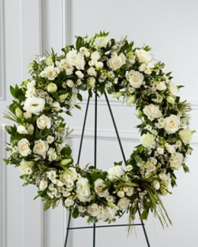 <p>The FTD® Splendor™ Wreath is a symbol of lasting love and kinship, whether for the deceased or in comfort of those suffering from a loss. Elegant white freesia, double lisianthus, spray roses, monte casino asters and limonium are accented with a variety of lush greens and green raffia ribbon, perfectly arranged in the form of a wreath, to create a beautiful way to display your sincere sentiments.</p>