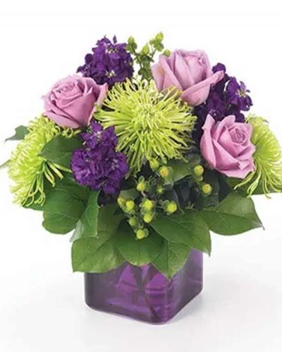 <p>There's no doubt that they'll love this Fun & Flirty arrangement of spider mums, purple stock, roses and hypericum in a trendy purple cube vase.</p>