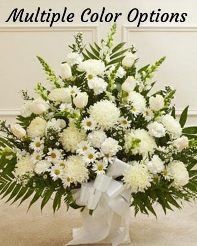 <p>Crafted from striking white blooms, our tasteful floor basket arrangement is a beautiful symbol of your care and concern in this time of sorrow. Hand-gathered with the freshest roses, mums, snapdragons and more, it's a beautiful expression of your sentiments as well as a touching way to remember a loved one who has passed. Appropriate for family, friends or business associates to send directly to the funeral home.</p>